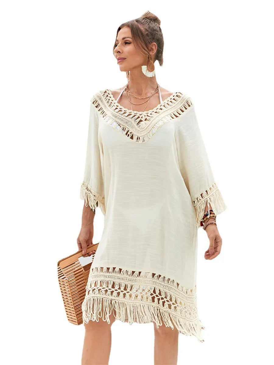 Apricot-coloured women's long hand-crocheted beach dress with a lining, shown as a swimsuit cover-up.