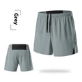 Men's loose fit off-road running shorts in grey, shown from front, with high waist and quick-dry fabric.