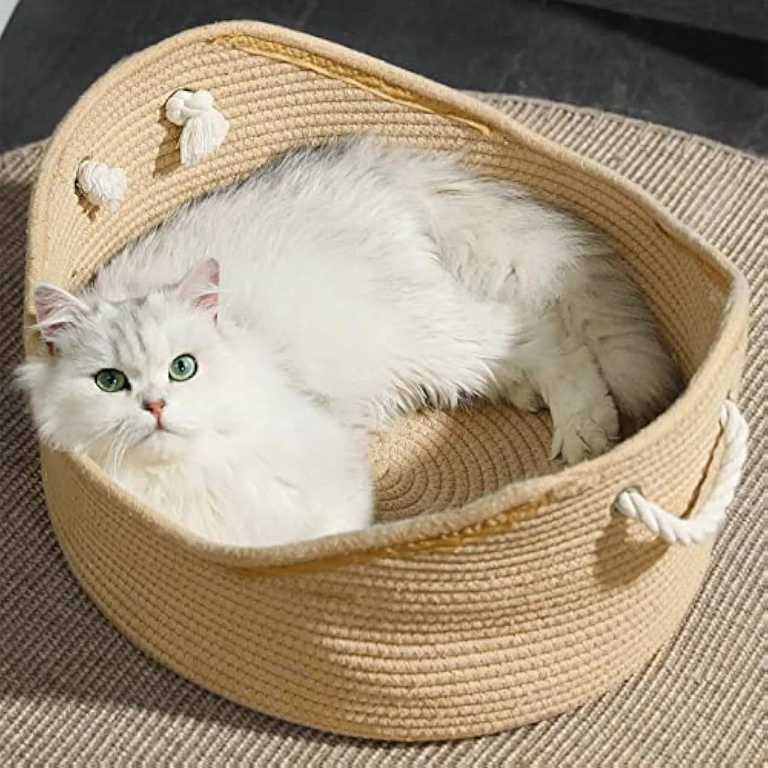 A square wicker cat bed basket with an integrated corrugated cardboard scratching panel on one side.