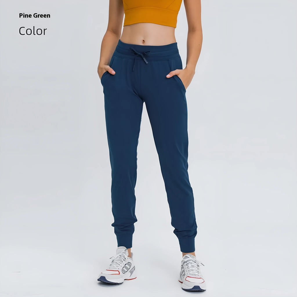 Women's high-waist yoga pants in distilled coffee colour with an elastic drawstring waist for fitness.