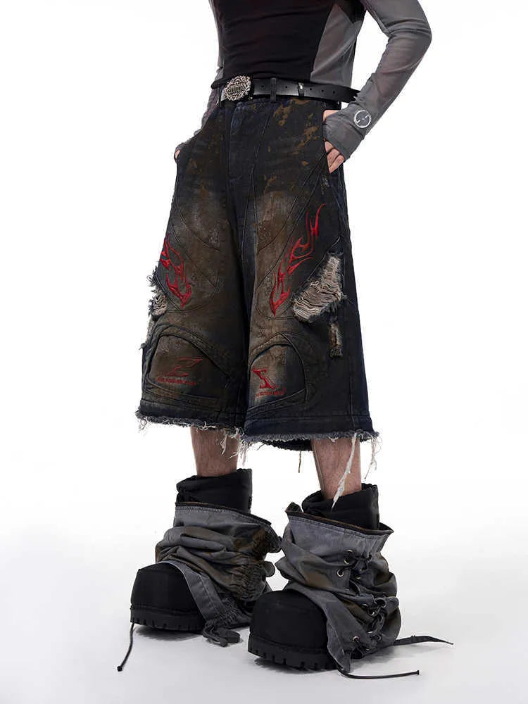 Men's retro denim jeans with detachable trouser legs in a wide leg, loose fit style.