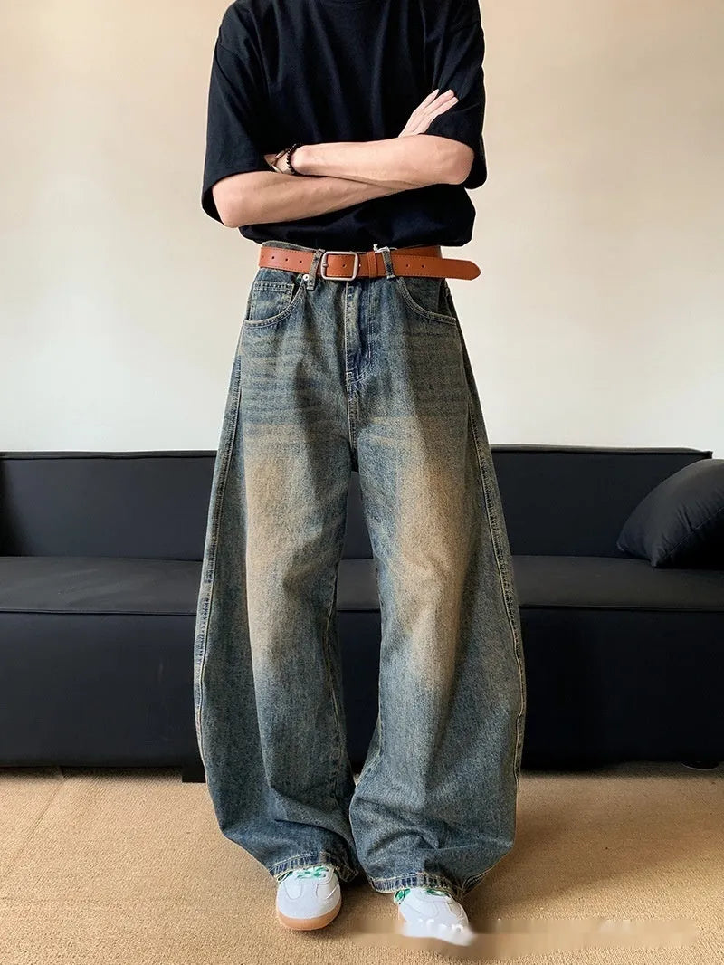Men's retro blue distressed denim jeans with wide-leg silhouette and micro elasticity fabric