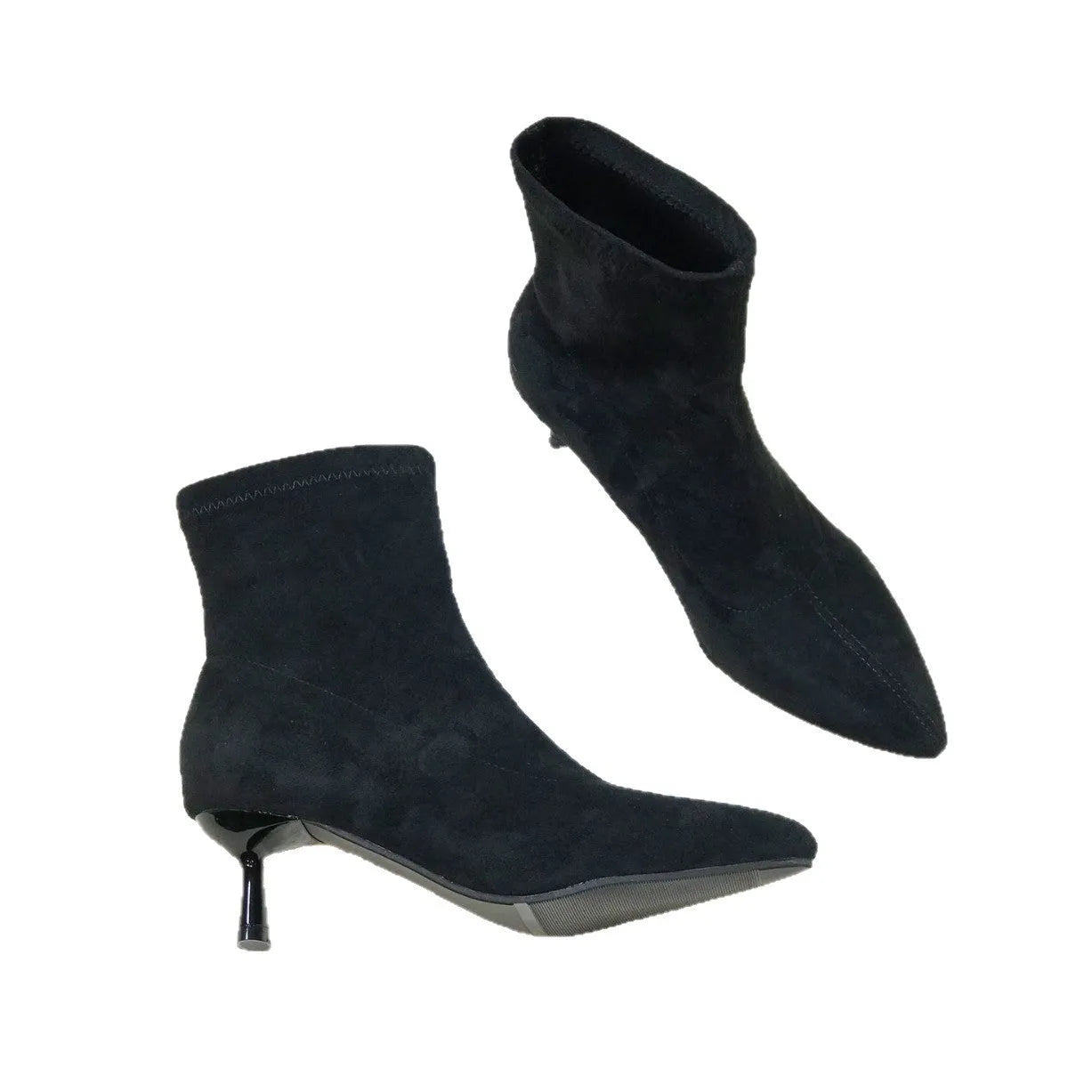Black pointed toe women's ankle boots with a high stiletto heel on a rubber sole.