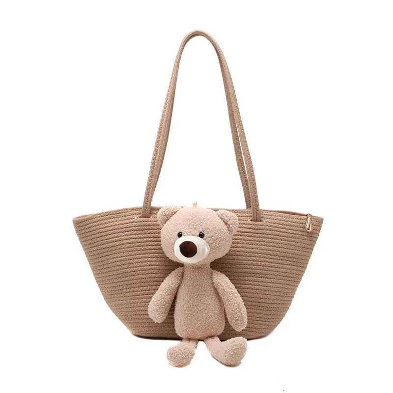 Cotton and linen woven shoulder bag in dumpling shape with three-dimensional pocket and double straps