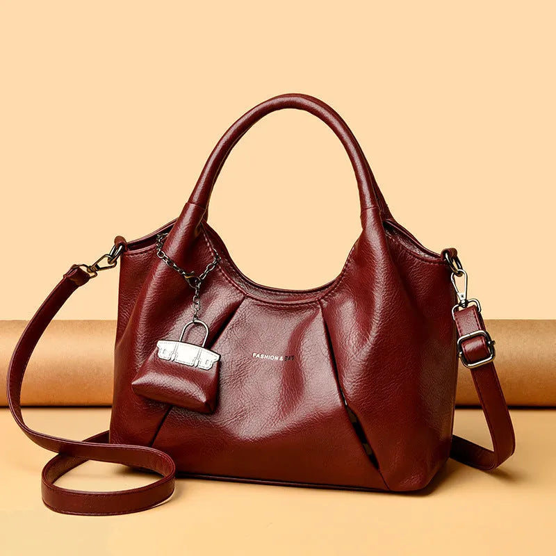 Trendy niche women's new shoulder bag in genuine leather with dumpling shape and pleated detail, khaki colour