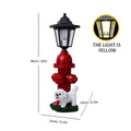 Solar hexagonal garden lamp with decorative resin figurine on plastic base for outdoor pathway lighting