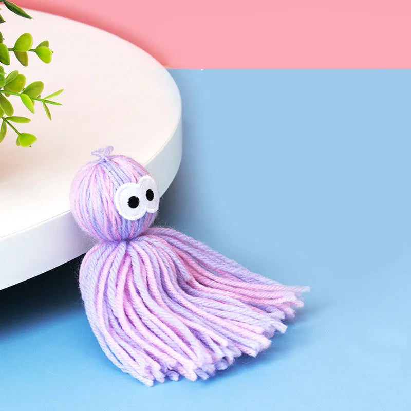 Bite-resistant wool ball cat toy with grinding teeth surfaces and hanging string in blue grey colour