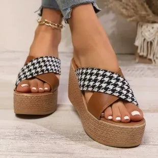 Cross leopard plaid pattern wedge sandals with a brown and black design and a rubber sole.