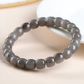 Straight cut smokey violet Hetian jade bracelet with approximately 24 beads, each 8mm by 9mm.