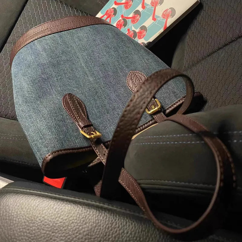 Denim patchwork one-shoulder bucket handbag showing dimensions and polyester construction