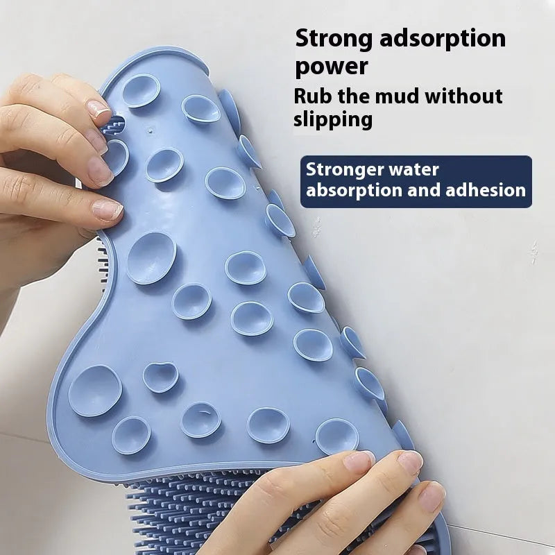 Blue silicone bath rub cushion mat for back scrubbing, shown flat with textured surface.