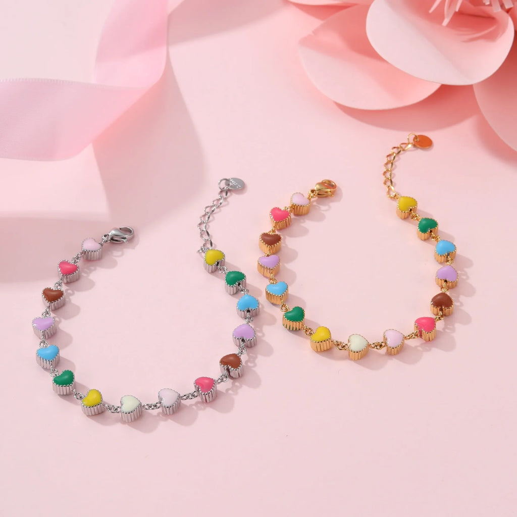 Gold or steel coloured women's bracelet with heart-shaped titanium steel pendant on stainless steel band