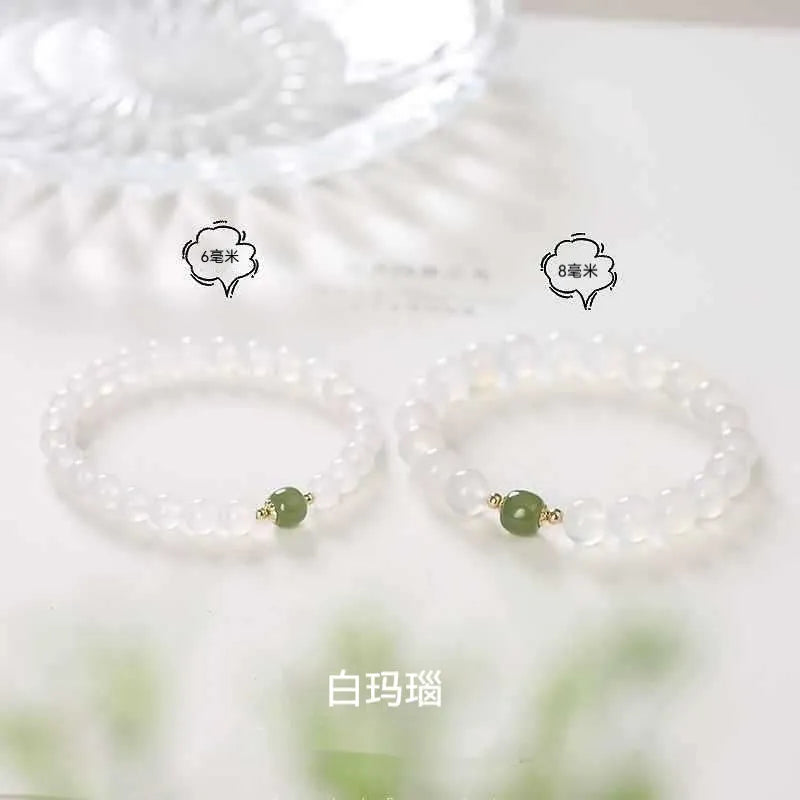 Handmade natural white agate crystal bracelet with cinnabar detail in 6mm or 8mm bead size.