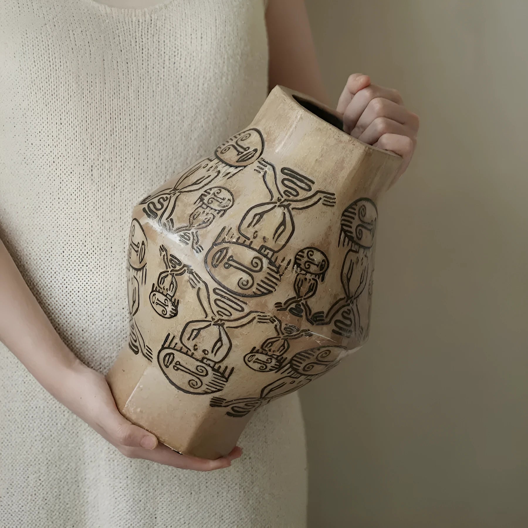 Hand-painted ceramic cylindrical vase with tribal totem patterns in vintage carved style