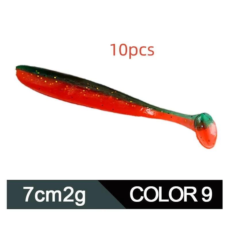 Soft plastic T-tail fishing lure in two-tone mandarin fish pattern, 7cm long.