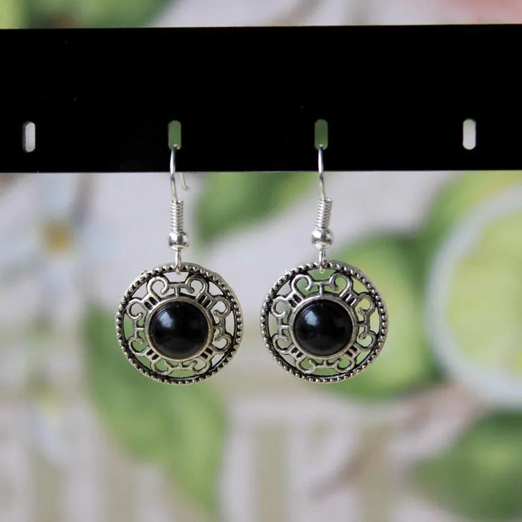 Handmade Miao silver ethnic earrings with turquoise stones in geometric flower disk design