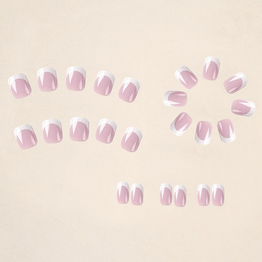 24 white fake nail plates with a black and white plaid pattern, shown in a nail tip style.
