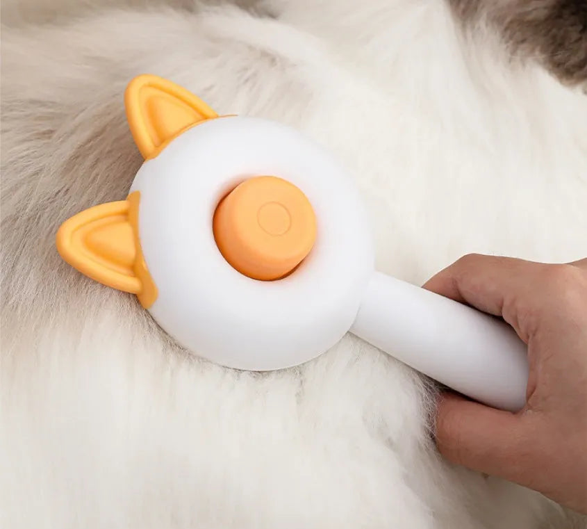Self-cleaning cat grooming comb with stainless steel blades in greenish white or orange white colours