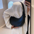 Women's retro dumpling shape shoulder bag in black with sandwich pocket and synthetic leather lining