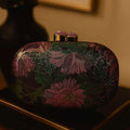 Ladies hard shell oval clutch bag in PU leather with open pocket shown in blue