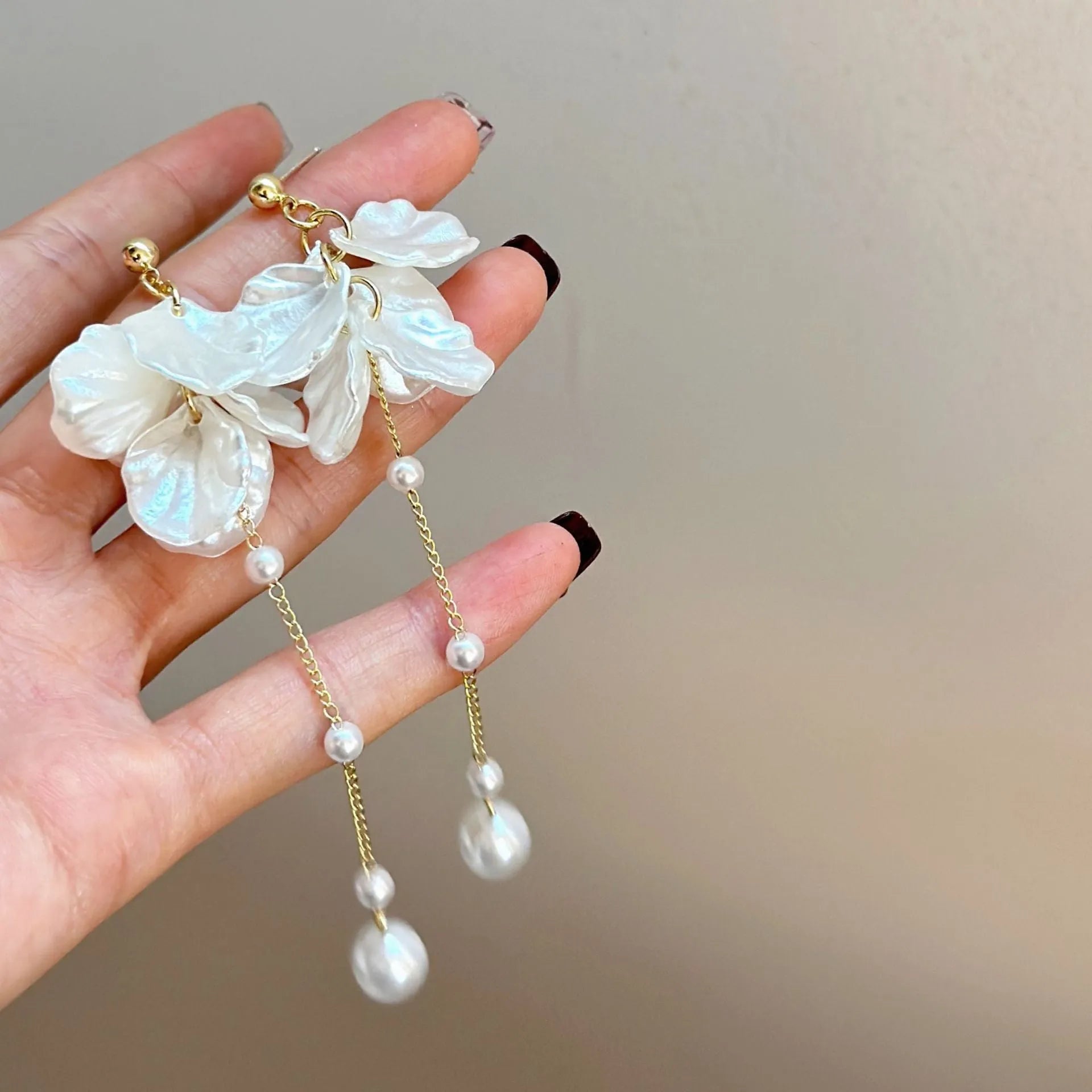 Women's acrylic earrings with pearl and shell tassel design measuring 8.8cm length