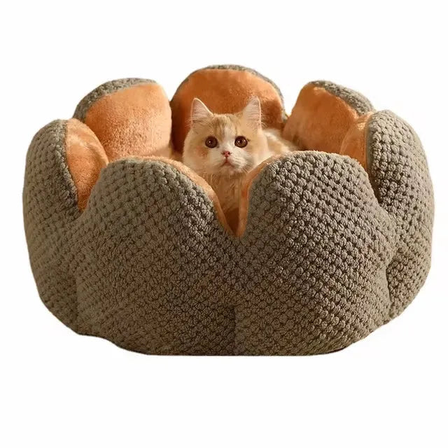Green cactus petal shape plush kennel bed for cats and small dogs on a hardwood floor.