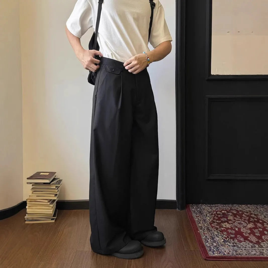 Men's brown wide-leg straight-cut casual trousers made from a polyester blend fabric on a hanger.