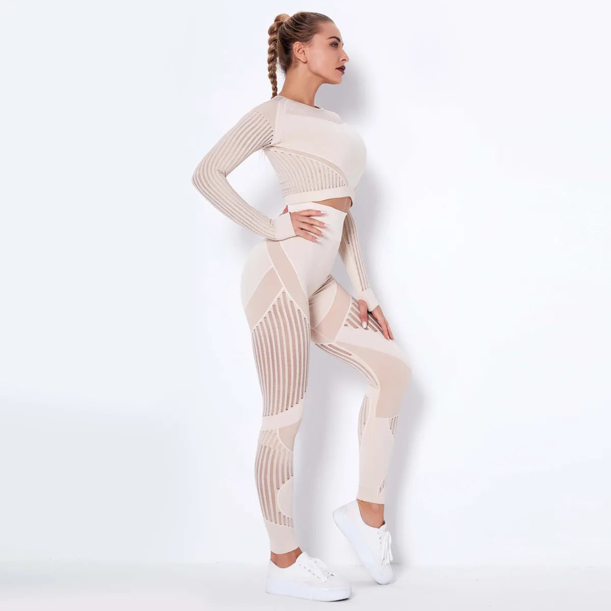 Women's long-sleeved seamless knitted yoga suit in a neutral colour, showing the stretch fabric and close fit.