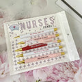 Five nurse-themed retractable ballpoint pens showing plastic construction and medical humour design elements