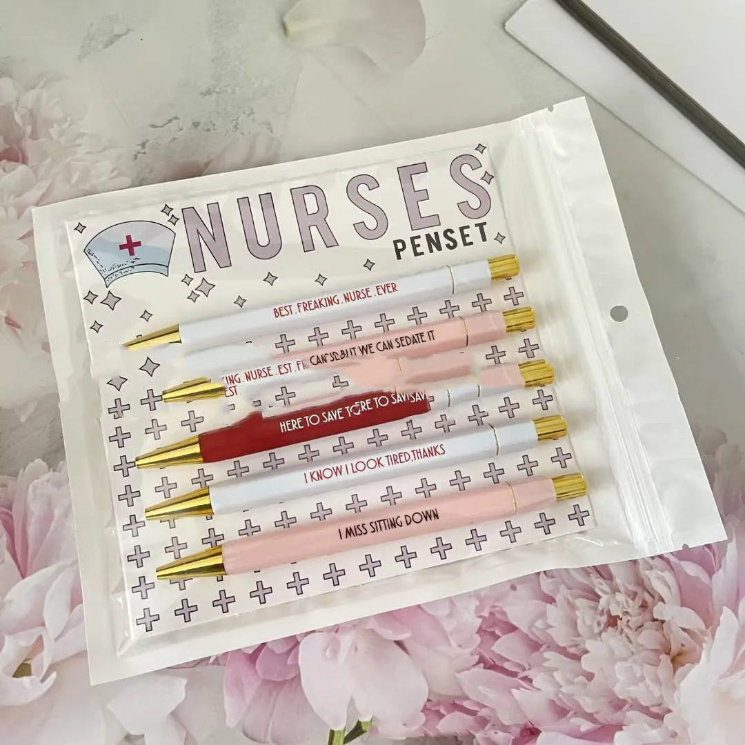 Five nurse-themed retractable ballpoint pens showing plastic construction and medical humour design elements