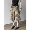 Yellow snake pattern camouflage cropped jeans on a neutral background