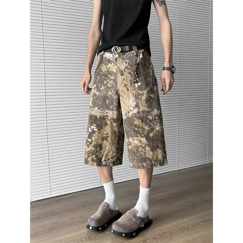 Yellow snake pattern camouflage cropped jeans on a neutral background