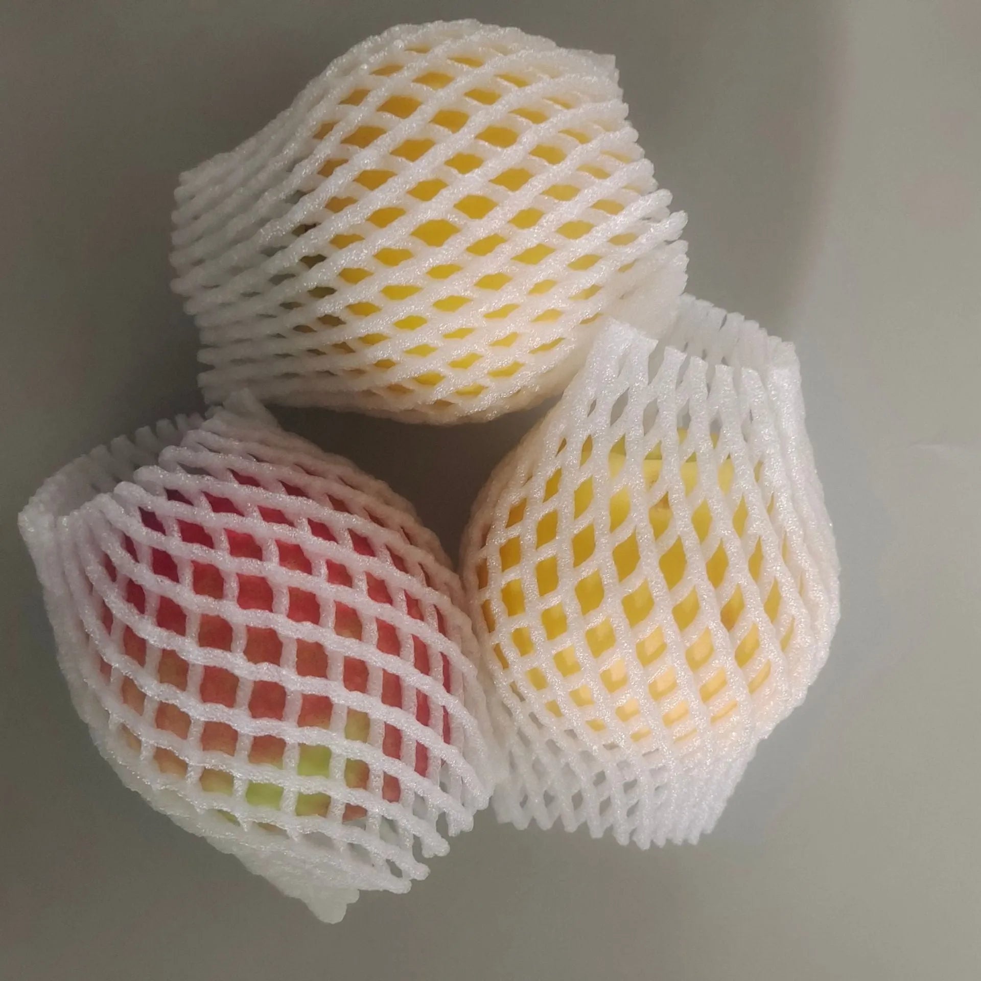 White foam fruit protective net cover showing shockproof design for produce protection