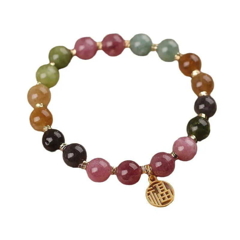 Electroplated tourmaline bracelet with flower and fu character pendant designs in natural colours