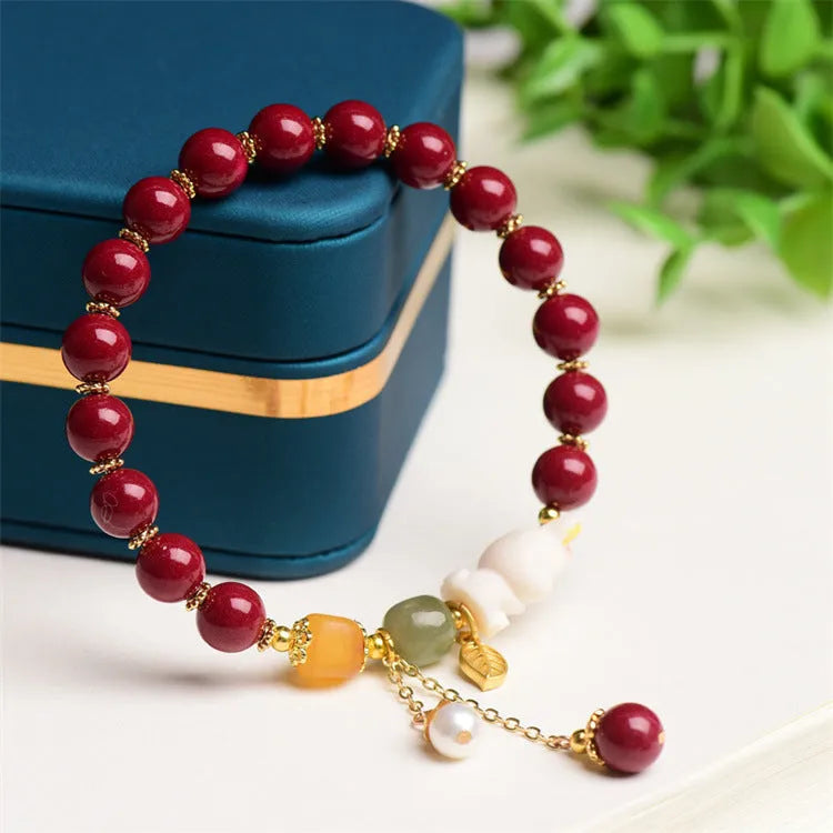 Natural cinnabar bracelet with rabbit motif in traditional Chinese design