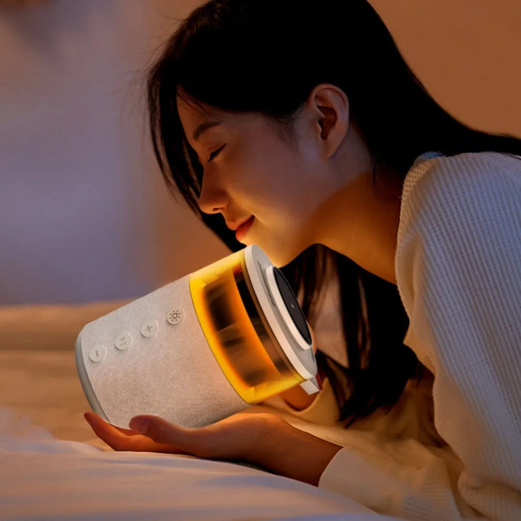 White three-in-one wireless magnetic Bluetooth charger with lighting on a household desk