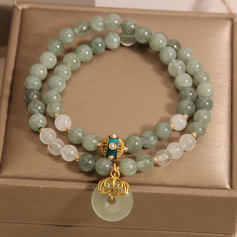 Women's double-layer aventurine jade bracelet with peace buckle closure in emerald green