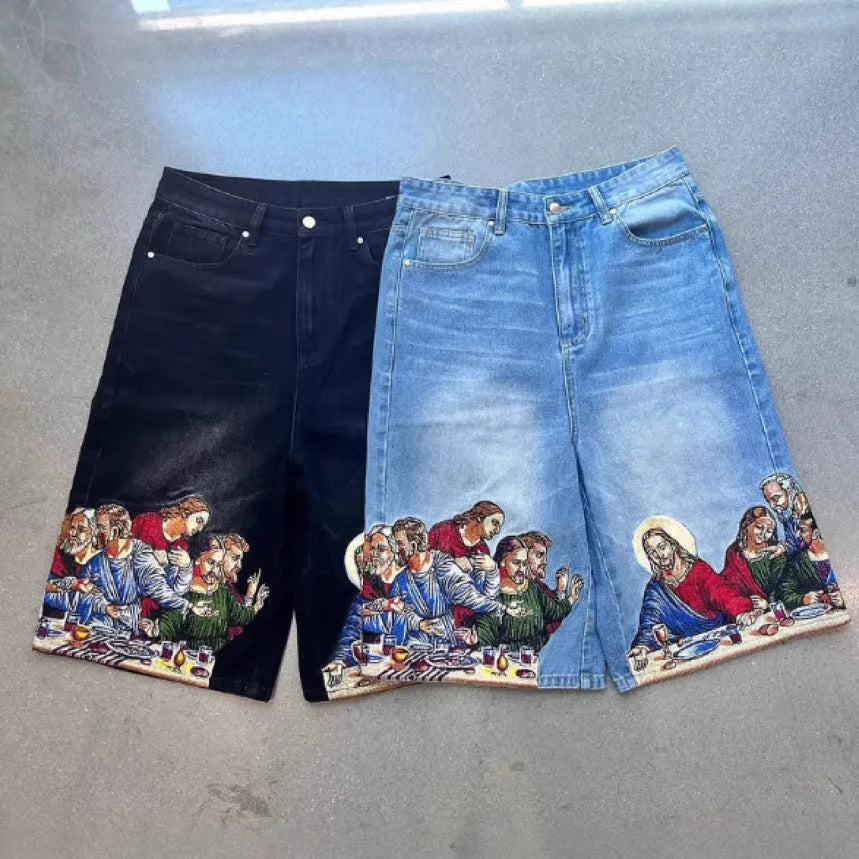 Blue cotton men's shorts with a Jesus Christ screen print on the back pocket, showing tapered leg fit.
