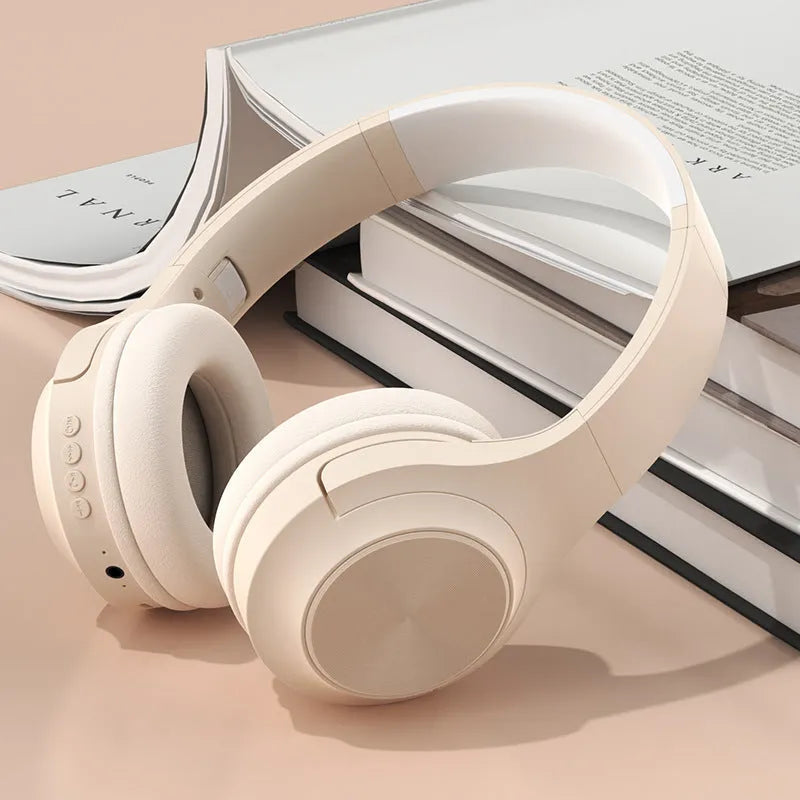 Wireless Bluetooth headset in ivory white, chalk black, or youth green colour, showing head-mounted design.