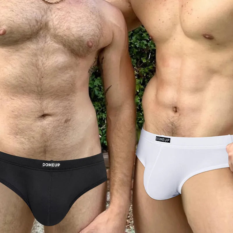 Men's seamless low-waist briefs in black, white, and pink solid colours