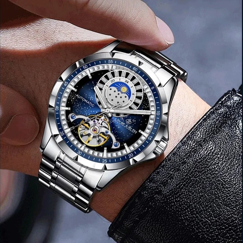 Men's silver alloy automatic watch with blue dial and stainless steel strap on wrist