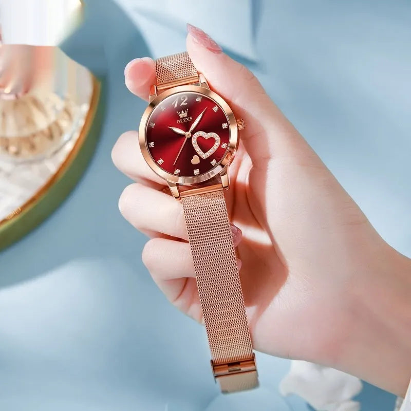 Women's rose gold fashion watch with mesh strap showing six dial colour options