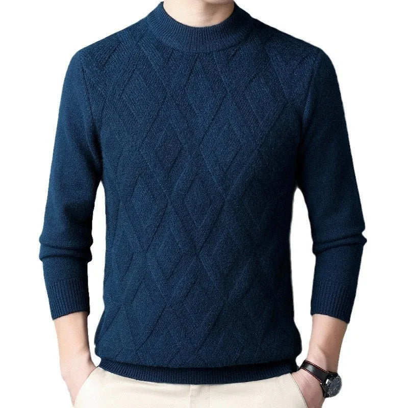 Man wearing a thick grey diamond jacquard knit pullover sweater.