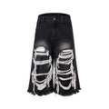 Black women's wide-leg cropped jeans with ripped patch details on the legs.