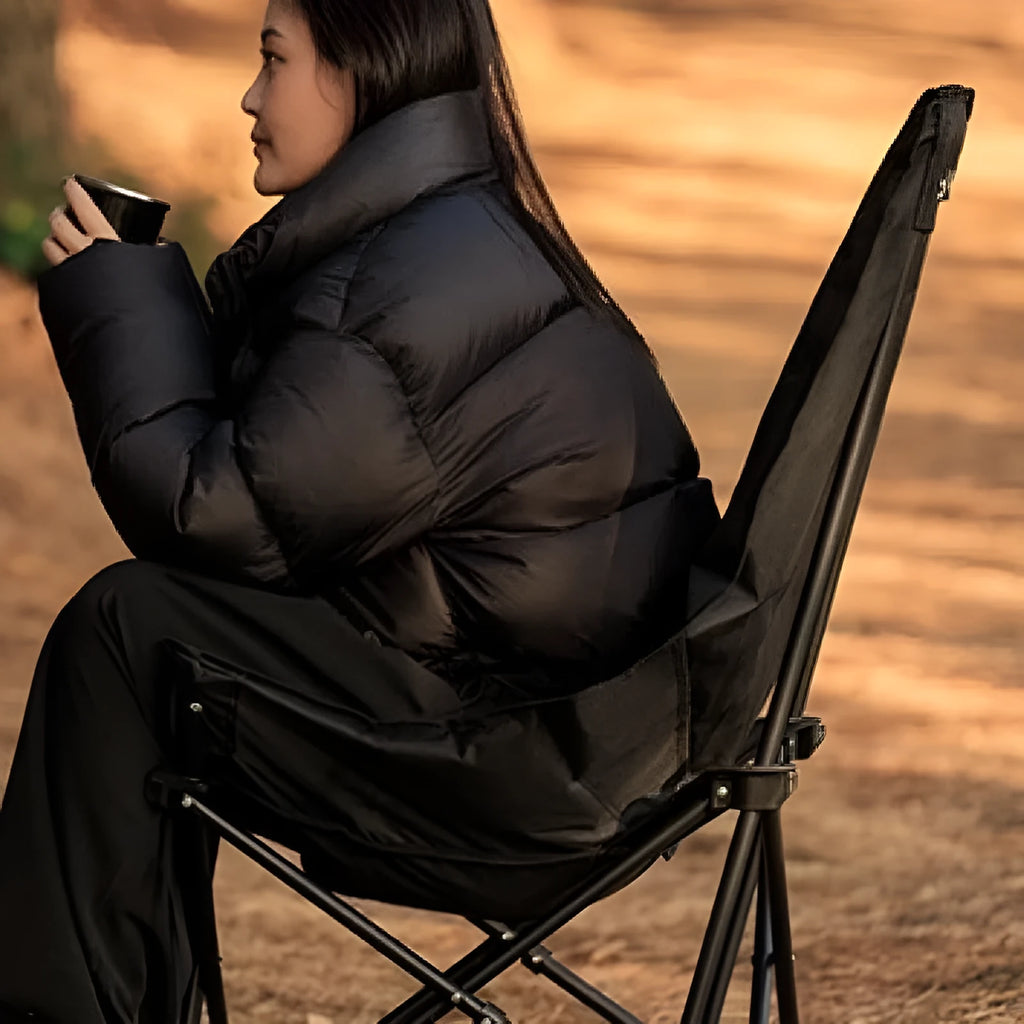 Night black folding moon chair with Oxford cloth seat shown folded and unfolded