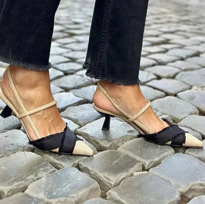 Apricot black women's pointed toe stiletto sandals with a buckle fastening.