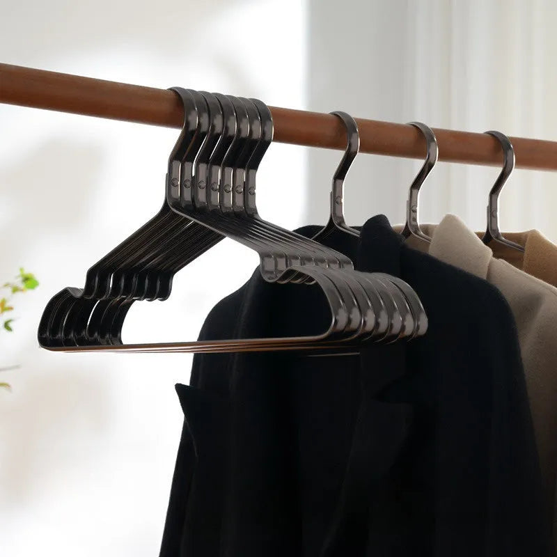 Elegant black modern clothes hanger with non-slip anti-rust surface for shirts and trousers.