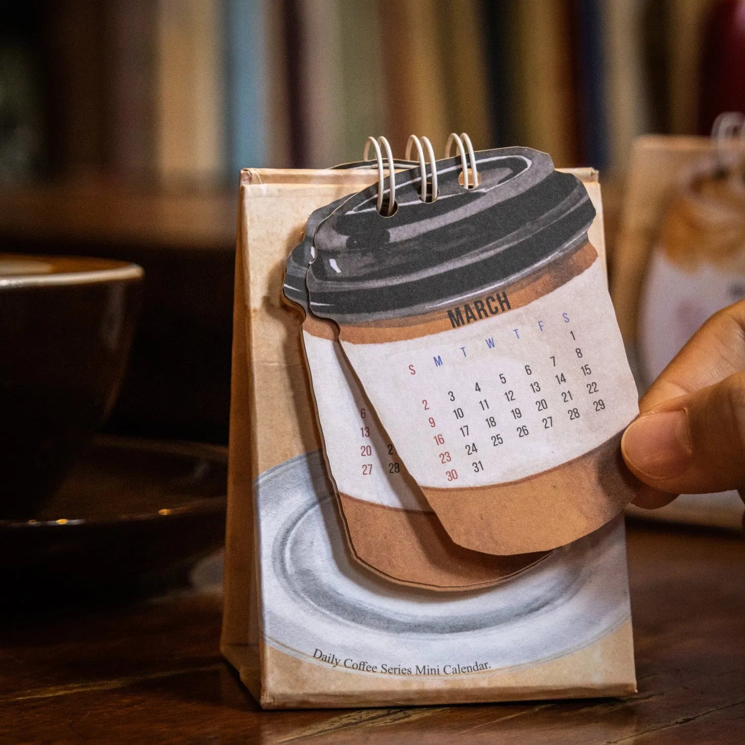 Coffee themed mini desk calendar 2025 with ten different daily designs including Coffee Time and Life Is Not Easy
