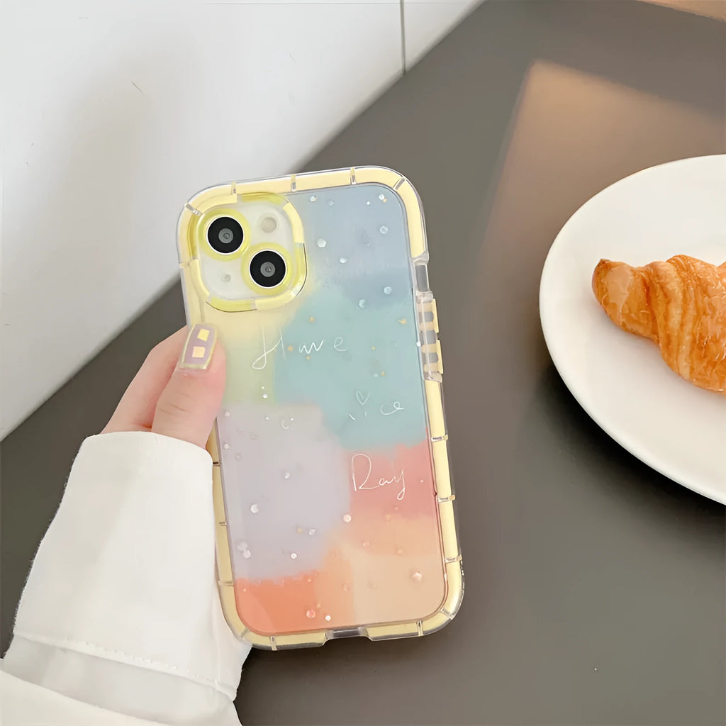 Minimalist yellow-edged silicone phone case for iPhone 14 and other models on a table.