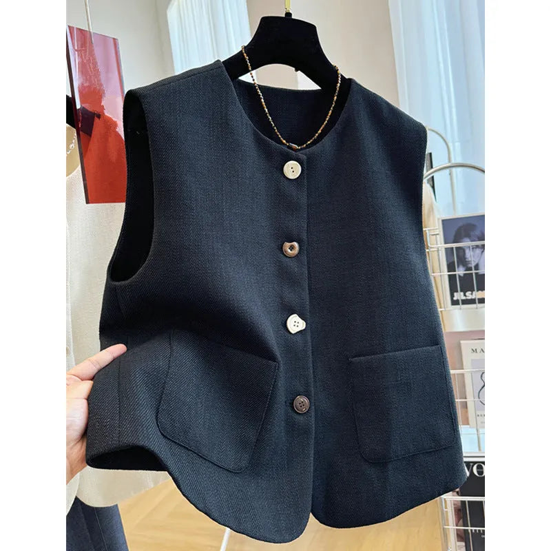 Women's round neck sleeveless vest in polyester with French bandage style, shown in milky white and black colours